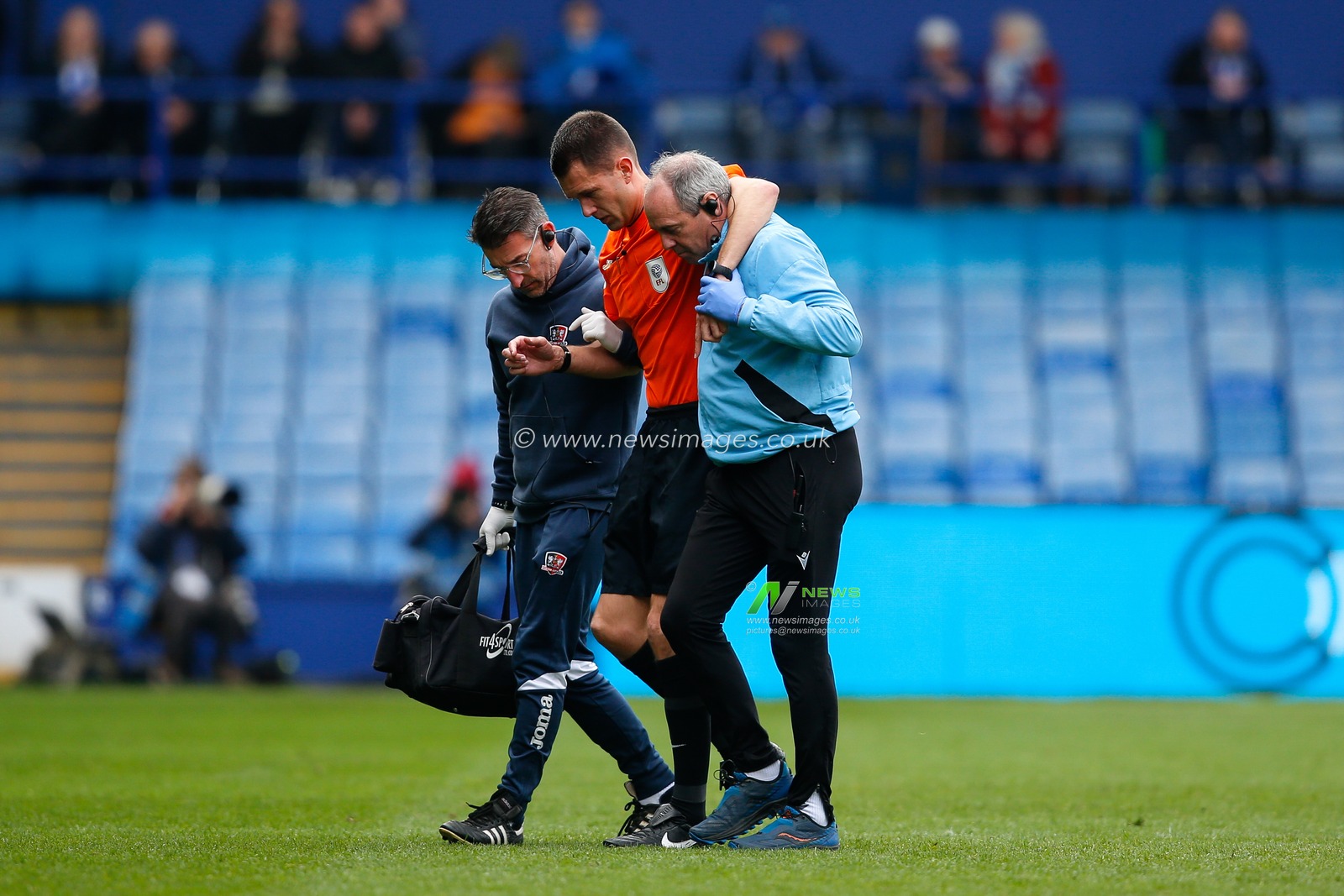 Referee Declan Bourne is helped off the pitch during the Sky Bet League 1 match Sheffield Wednesday vs Exeter City at Hillsborough, Sheffield, United Kingdom, 22nd April 2023

(Photo by Ben Early/News Images)