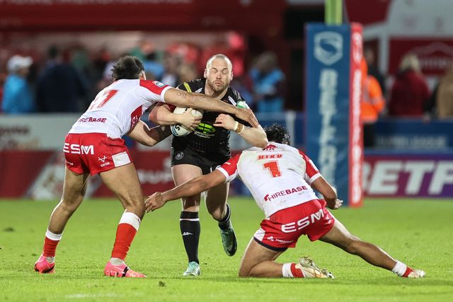 Liam Marshall of Wigan Warriors is tackled by Tyrone May of Hull KR and Peta Hiku of Hull KR during the Betfred Super League Round 9 match Hull KR vs Wigan Warriors at Sewell Group Craven Park, Kingston upon Hull, United Kingdom, 26th April 2024

(Photo by Mark Cosgrove/News Images)