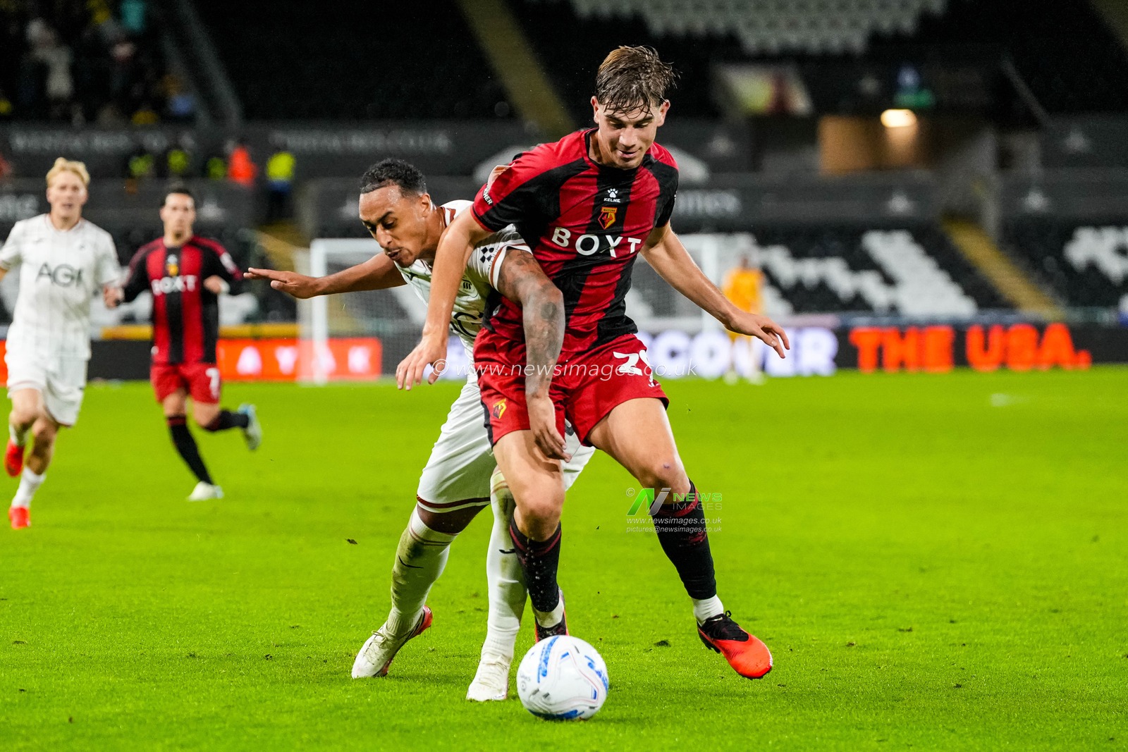 Branimir Miacic of Watford and Adam Idah of Swansea City dual for the ball during the Sky Bet Championship match Swansea City vs Watford at Swansea.com Stadium, Swansea, United Kingdom on 01 September 2026

(Photo by Andrew Lewis/News Images)