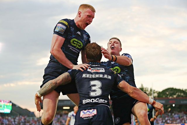 Adam Keighran of Wigan Warriors celebrates his try with Zach Eckersley of Wigan Warriors and Jai Field of Wigan Warriors during the Betfred Super League round 15 match Wakefield Trinity vs Wigan Warriors at DIY Kitchens Stadium, Wakefield, United Kingdom, 20th June 2025(Photo by Sam Eaden/News Images)