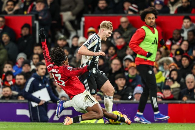 Lewis Hall of Newcastle United is tackled by Patrick Dorgu of Manchester Untied during the Premier League match Manchester United vs Newcastle United at Old Trafford, Manchester, United Kingdom, 26th December 2025

(Photo by Alfie Cosgrove/News Images)

*** GER AUT SUI OUT ***