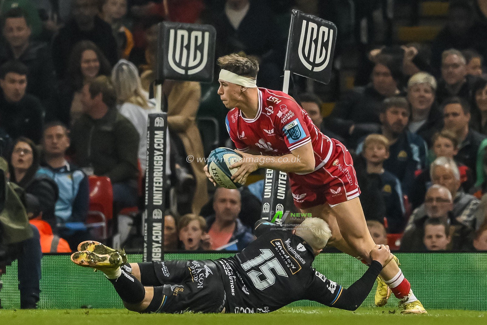 Tom Rogers of Scarlets is tackled into touch by Jordan Williams of the Dragons during the United Rugby Championship match Dragons Rugby vs Llanelli Scarlets at Principality Stadium, Cardiff, United Kingdom, 22nd April 2023

(Photo by Craig Thomas/News Images)