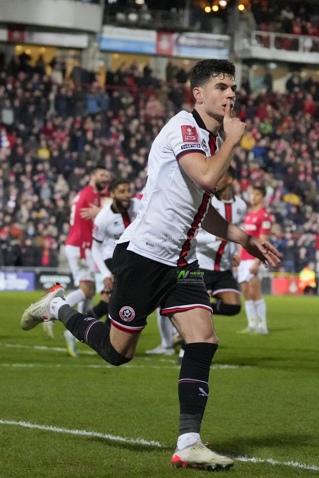 John Egan #12 of Sheffield United reacts after he scores a 95th minute equaliser to make the score 3-3 during the Emirates FA Cup fourth round match Wrexham vs Sheffield United at The Racecourse Ground, Wrexham, United Kingdom, 29th January 2023

(Photo by Steve Flynn/News Images)