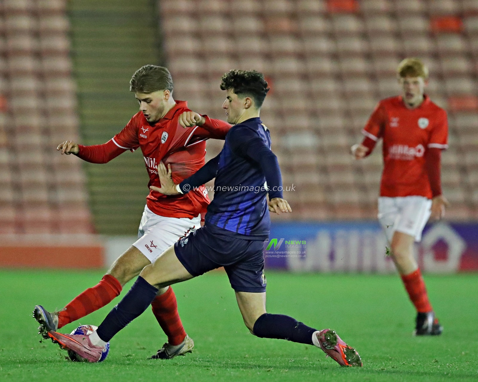 Max Woodcock of Barnsley FC U18's is pressured by Jacob Stubbs of Mansfield Town U18's during the FA Youth Cup U18’s round 2 match Barnsley vs Mansfield Town at Oakwell, Barnsley, United Kingdom, 17th November 2025(Photo by Sam Eaden/News Images)