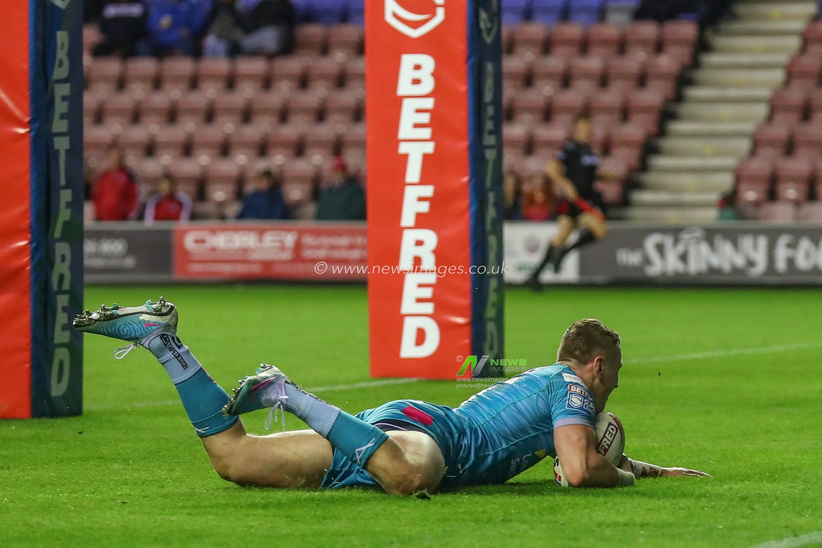 Harry Newman #3 of Leeds Rhinos goes over for a try and makes the score 18-22 during the Betfred Super League Round 12 match Wigan Warriors vs Leeds Rhinos at DW Stadium, Wigan, United Kingdom, 12th May 2023

(Photo by Gareth Evans/News Images)