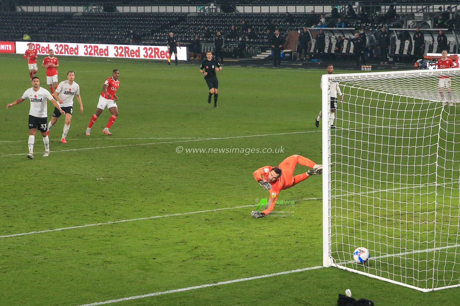 Victor Adeboyejo #29 of Barnsley scores to make it 0-2