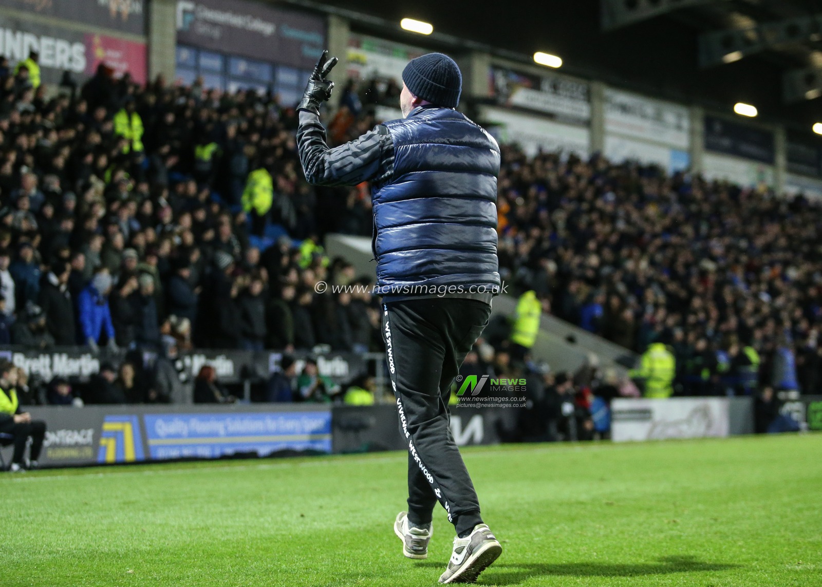 Chesterfield fan invades the pitch  to celebrate Chesterfield  taking the lead during the Sky Bet League 2 match Chesterfield vs Notts County at SMH Group Stadium, Chesterfield, United Kingdom, 26th December 2025

(Photo by Richard Bierton/News Images)

*** GER AUT SUI OUT ***