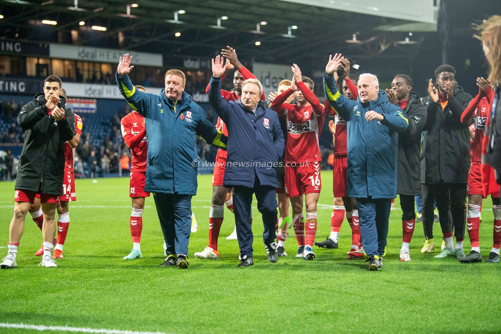 Neil Warnock manager of Middlesbrough and his team wave goodbye to the travelling support.