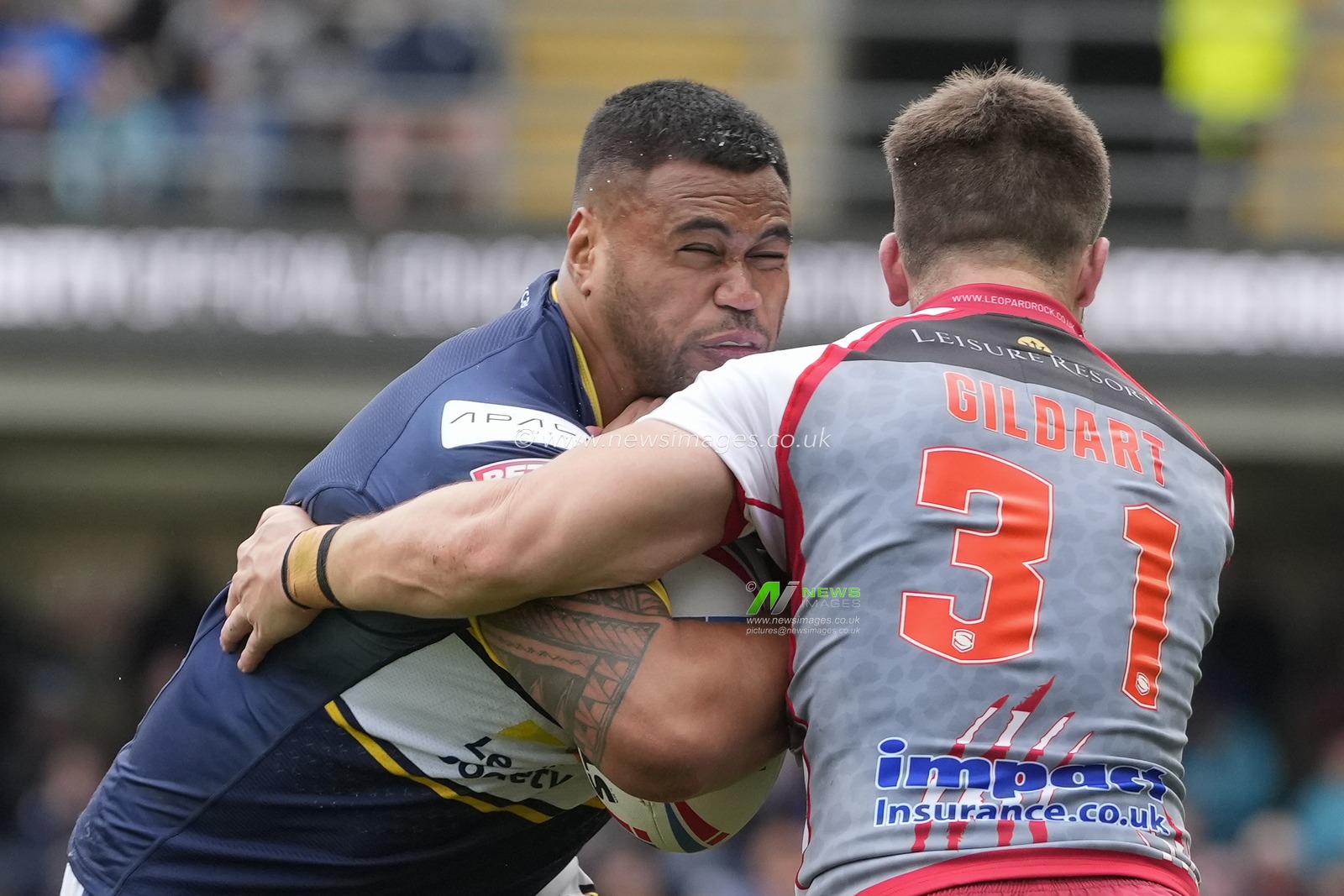 Oliver Gildart #31 of Leigh Leopards tackles Sam Lisone #15 of Leeds Rhinos during the Betfred Super League Round 21 match Leeds Rhinos vs Leigh Leopards at Headingley Stadium, Leeds, United Kingdom, 6th August 2023

(Photo by Steve Flynn/News Images)