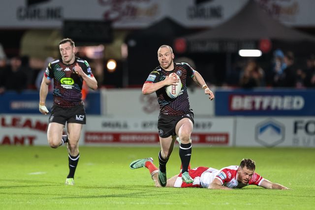 Liam Marshall of Wigan Warriors breaks after a failed tackle by former team mate Joe Burgess of Hull KR during the Betfred Super League Round 9 match Hull KR vs Wigan Warriors at Sewell Group Craven Park, Kingston upon Hull, United Kingdom, 26th April 2024

(Photo by Mark Cosgrove/News Images)