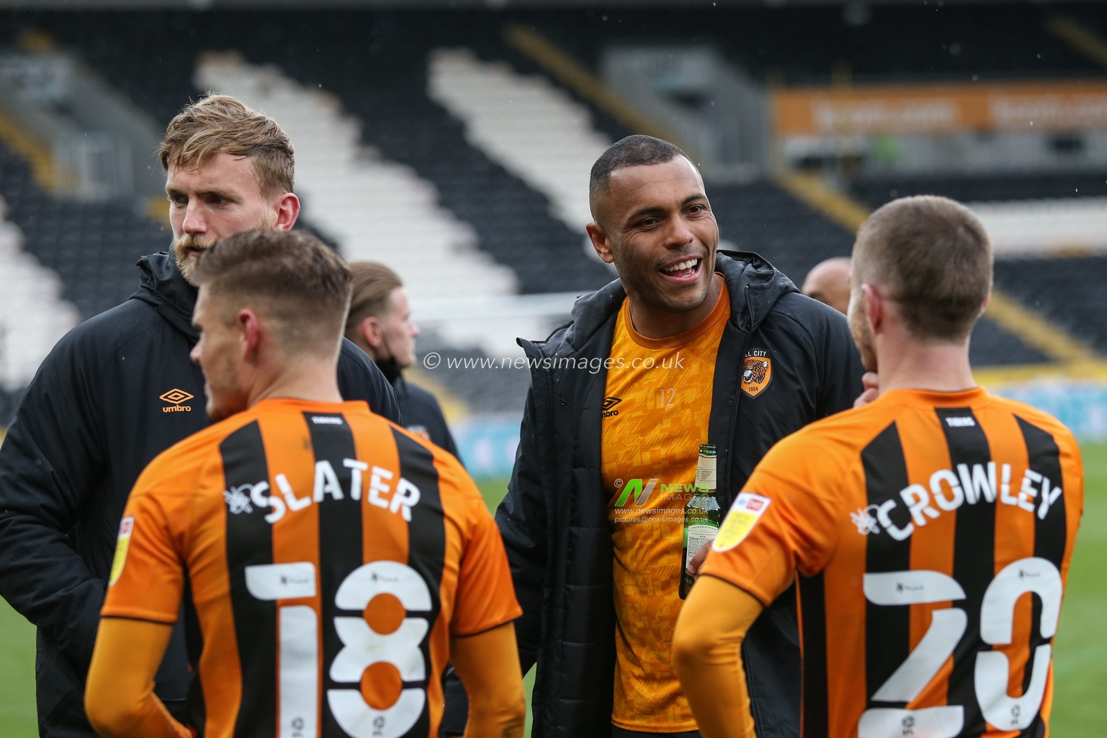 Josh Magennis #27 of Hull City celebrates with a beer with Regan Slater #18, Dan Crowley #20 and George Long #1 of Hull City