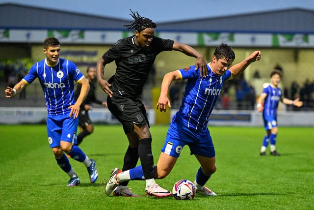 Niall Ennis of Stoke City and Harrison Burke of Chester battle for the ball during the Pre-season friendly match Chester vs Stoke City at Deva Stadium, Chester, United Kingdom, 11th July 2024

(Photo by Cody Froggatt/News Images)