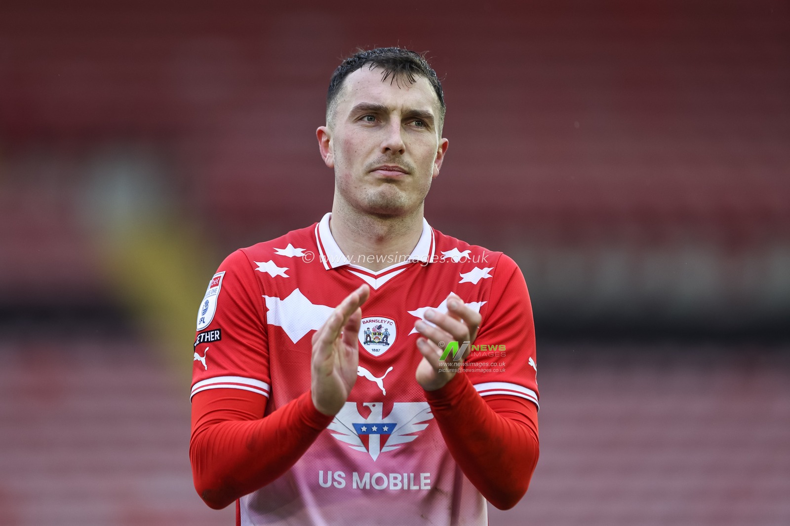 Josh Earl of Barnsley applauds the home fans during the Sky Bet League 1 match Barnsley vs Cheltenham Town at Oakwell, Barnsley, United Kingdom, 16th March 2024

(Photo by Mark Cosgrove/News Images)
