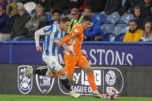 Ben Wiles of Huddersfield Town and Albie Morgan of Blackpool battle for the ball during the Sky Bet League 1 match Huddersfield Town vs Blackpool at John Smith's Stadium, Huddersfield, United Kingdom, 24th September 2024

(Photo by Alfie Cosgrove/News Images)