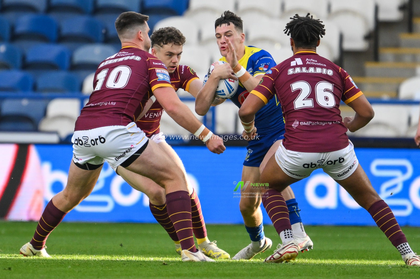 Josh Thewlis of Warrington Wolves is tackled by Joe Greenwood of Huddersfield Giants and Hugo Salabio of Huddersfield Giants during the Betfred Super League Round 26 match Huddersfield Giants vs Warrington Wolves at John Smith's Stadium, Huddersfield, United Kingdom, 14th September 2024

(Photo by Craig Thomas/News Images)