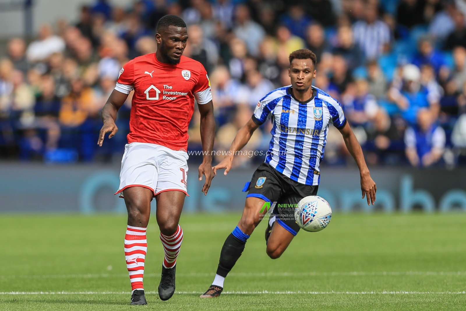 10th August 2019 , Hillsborough, Sheffield, England; Sky Bet Championship, Sheffield Wednesday vs Barnsley : Bambo Diaby (5) of Barnsley and Jacob Murphy (14) of Sheffield Wednesday chase the ball 

Credit: Mark Cosgrove/News Images,

English Football League images are subject to DataCo Licence