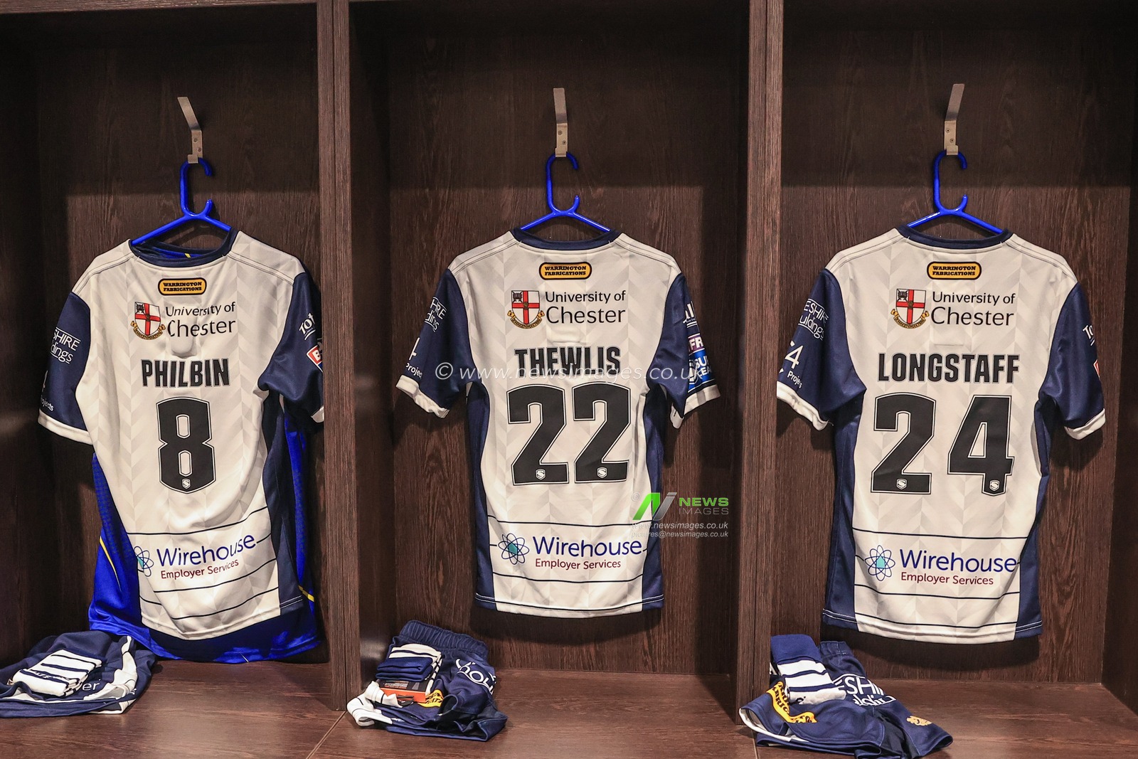 Warrington Dressing room game shirts of Joe Philbin #8 of Warrington Wolves, Josh Thewlis #22 of Warrington Wolves and Ellis Longstaff #24 of Warrington Wolves