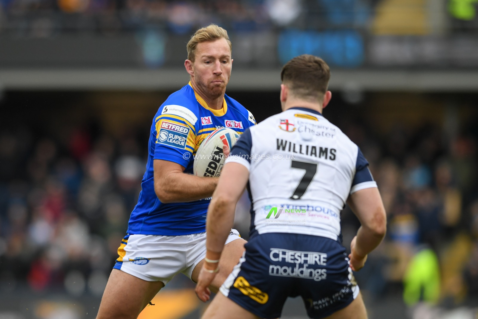 Matt Prior #10 of Leeds Rhinos looks for a way past George Williams #7 of Warrington Wolves