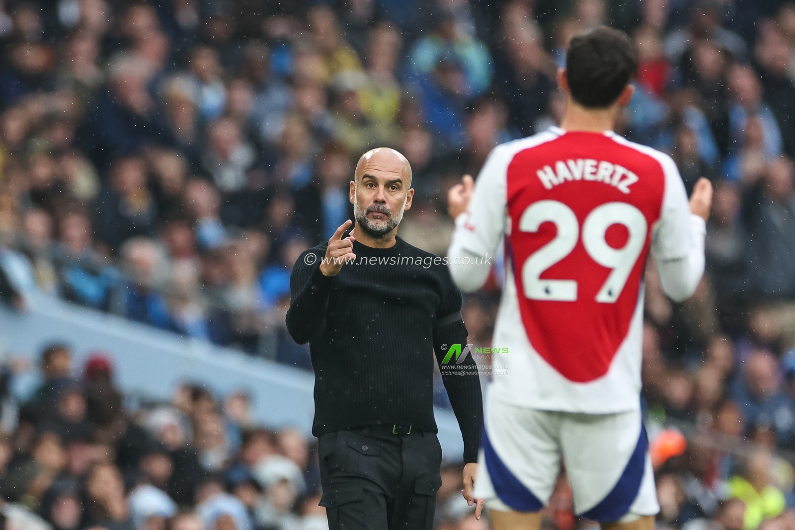 Pep Guardiola manager of Manchester City point to Kai Havertz of Arsenal during the Premier League match Manchester City vs Arsenal at Etihad Stadium, Manchester, United Kingdom, 22nd September 2024

(Photo by Mark Cosgrove/News Images)