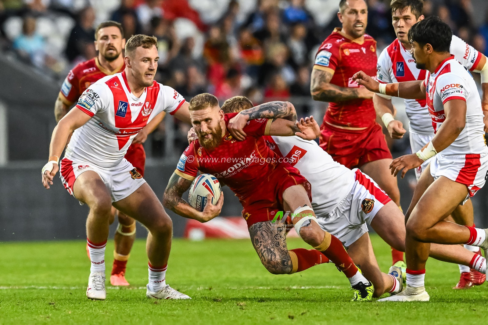 Sam Tomkins #29 of Catalans Dragons is tackled by George Delaney #30 of St Helens during the Betfred Super League Round 19 match St Helens vs Catalans Dragons at Totally Wicked Stadium, St Helens, United Kingdom, 13th July 2023

(Photo by Craig Thomas/News Images)