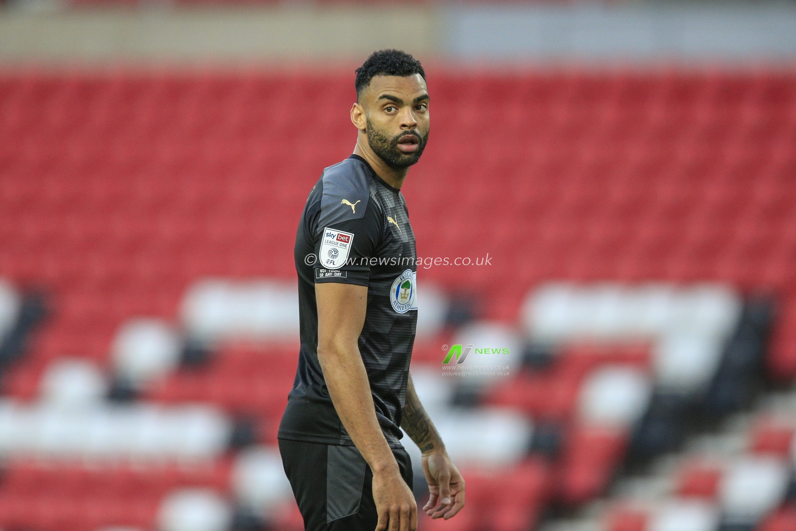 Curtis Tilt #4 of Wigan Athletic during the game