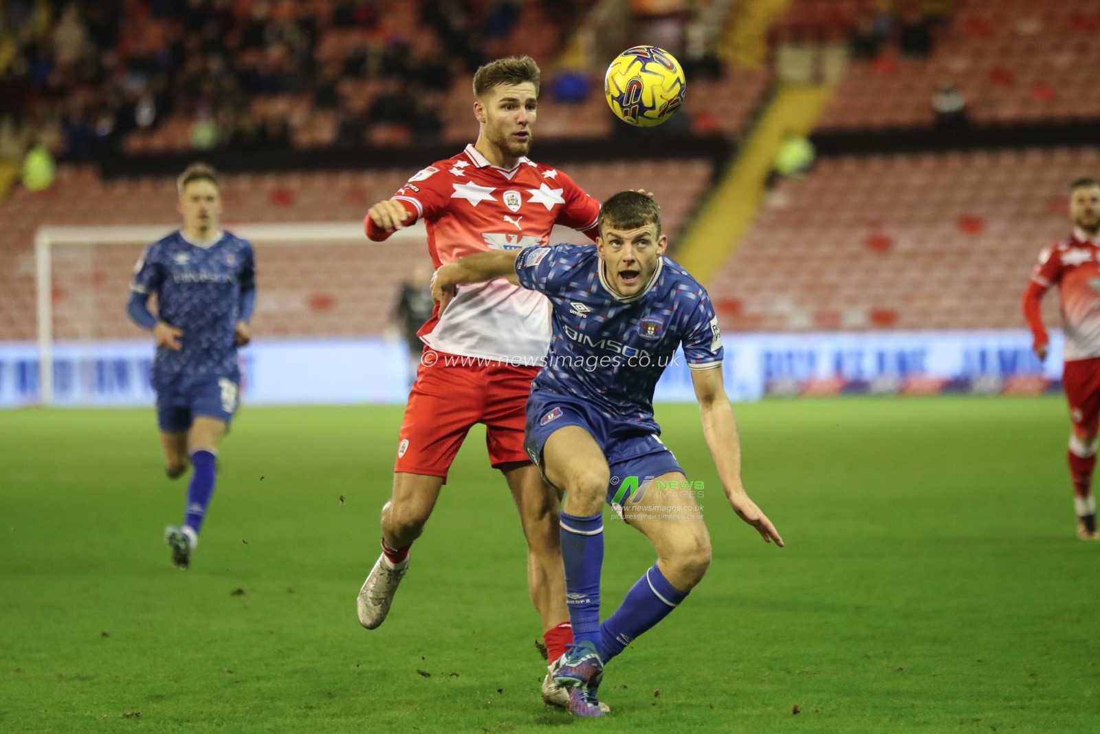 John Mcatee of Barnsley and Sam Lavelle of Carlisle United battle for the ball during the Sky Bet League 1 match Barnsley vs Carlisle United at Oakwell, Barnsley, United Kingdom, 16th January 2024

(Photo by Alfie Cosgrove/News Images)