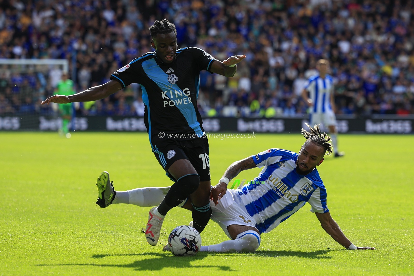 Sorba Thomas #14 of Huddersfield Town tackles Stephy Mavididi #10 of Leicester City during the Sky Bet Championship match Huddersfield Town vs Leicester City at John Smith's Stadium, Huddersfield, United Kingdom, 12th August 2023

(Photo by Conor Molloy/News Images)
