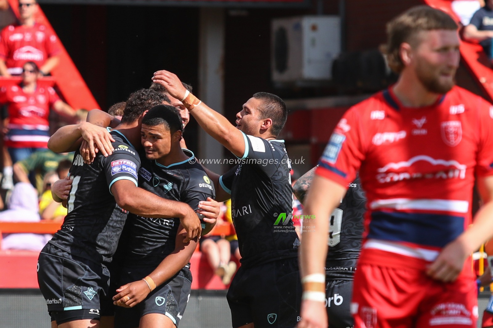 Leroy Cudjoe #21 of Huddersfield Giants celebrates his third try