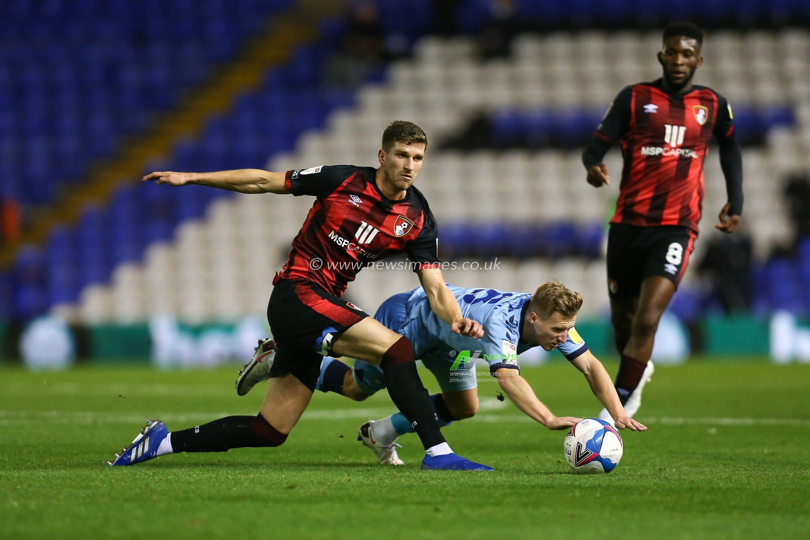 Jamie Allen of Coventry City is fouled by Chris Mepham of AFC Bournemouth