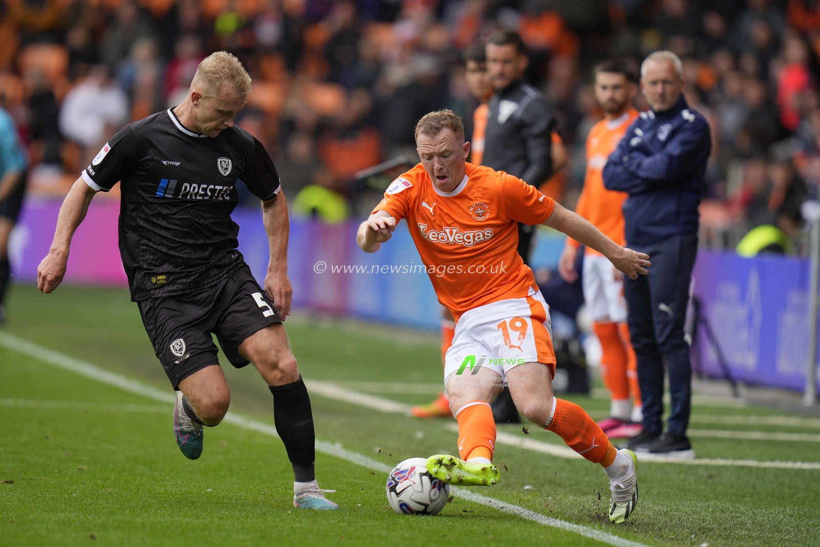 Sam Hughes #5 of Burton Albion competes for the ball with Shayne Lavery #19 of Blackpool during the Sky Bet League 1 match Blackpool vs Burton Albion at Bloomfield Road, Blackpool, United Kingdom, 5th August 2023

(Photo by Steve Flynn/News Images)