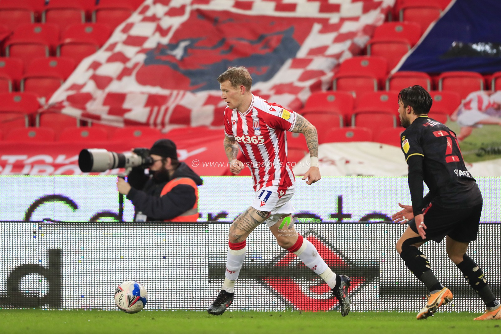 James McClean #11 of Stoke City passes the ball