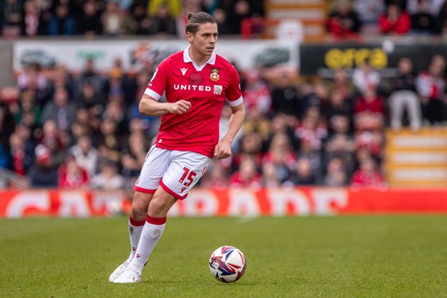 Wrexham's George Dobson carries the ball during the Sky Bet League 1 match Wrexham vs Stockport County at SToK Cae Ras, Wrexham, United Kingdom, 22nd March 2025

(Photo by Nik Mesney/News Images)