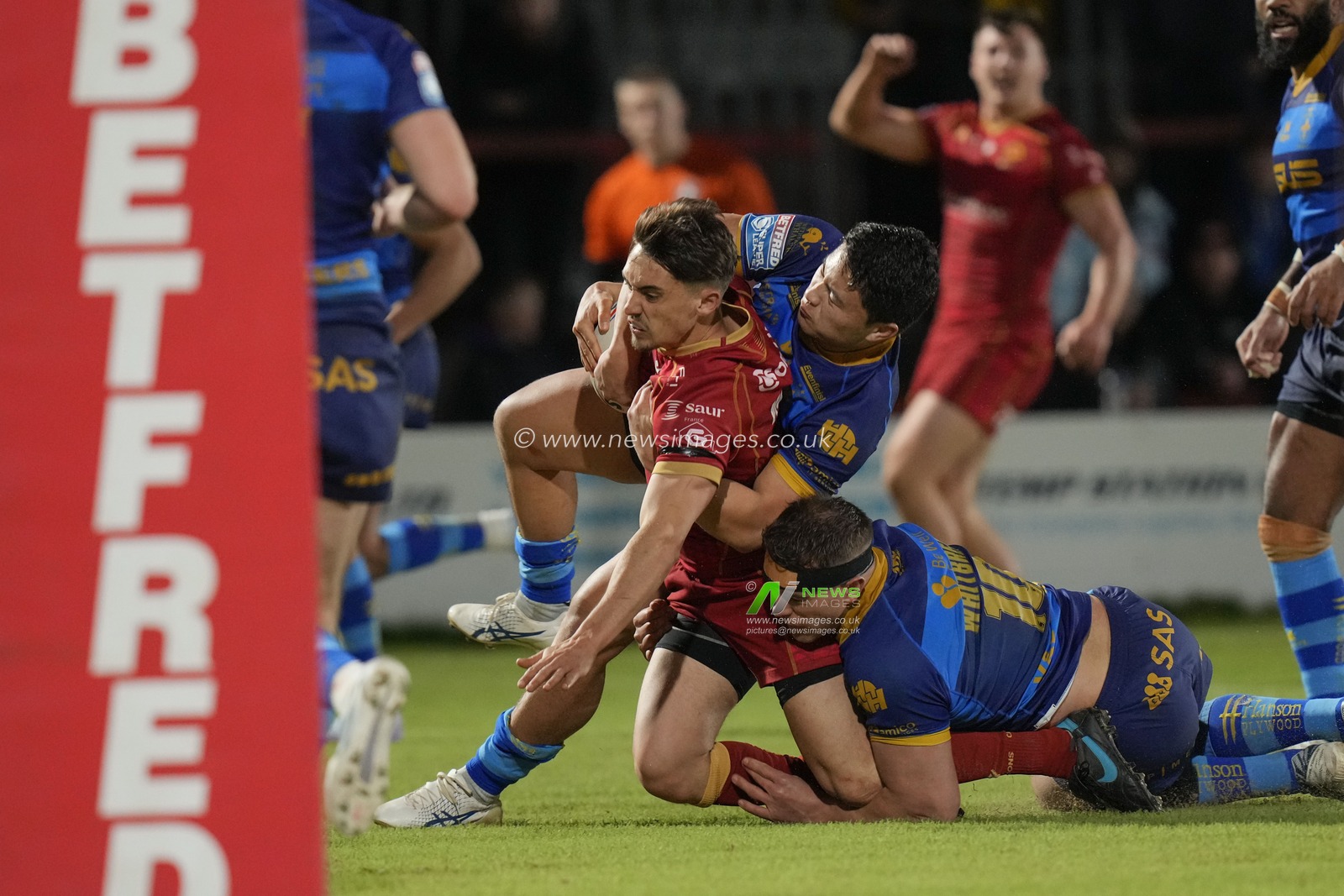 Arthur Mourgue #1 of Catalans Dragons is tackled during the Betfred Super League  Round 1 match Wakefield Trinity vs Catalans Dragons at The Be Well Support Stadium, Wakefield, United Kingdom, 17th February 2023

(Photo by Steve Flynn/News Images)