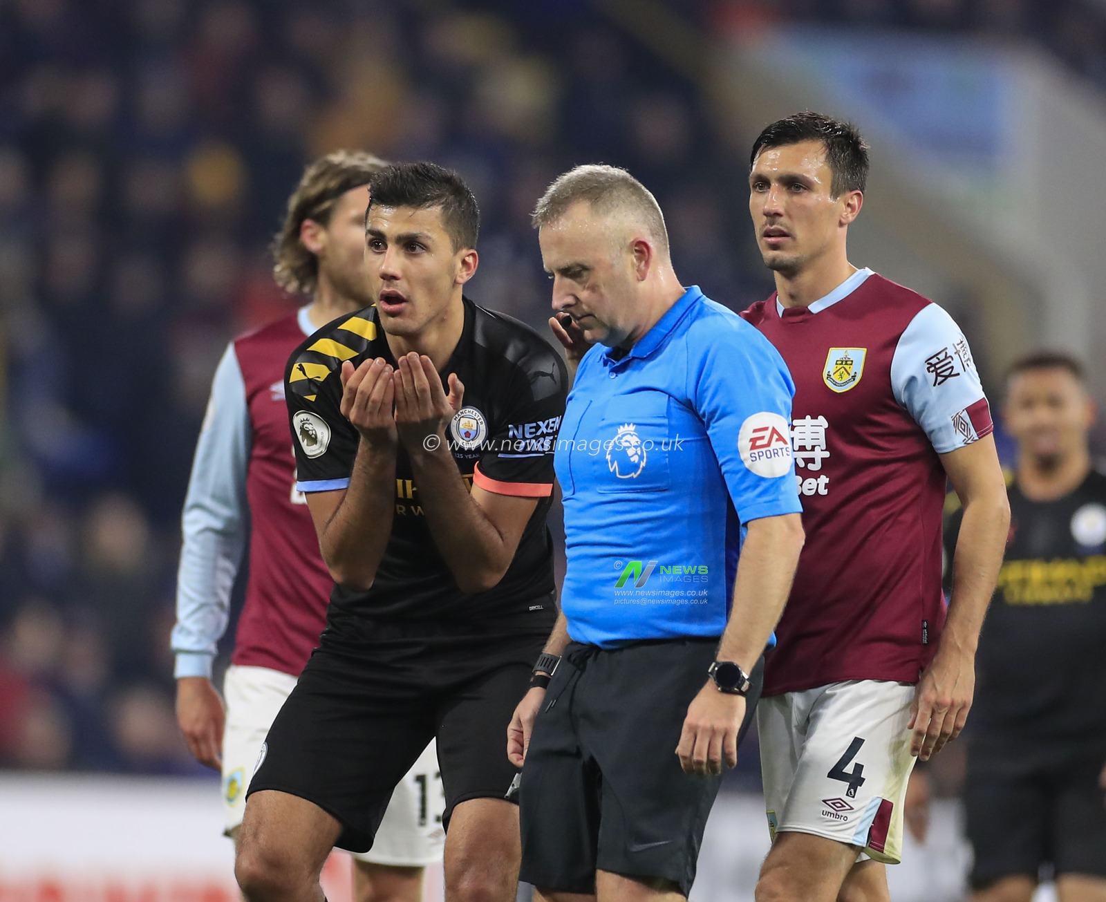 3rd December 2019, Turf Moor, Burnley, England; Premier League, Burnley v Manchester City : Rodri (16) of Manchester City pleads with referee John Moss after he awards a foul against him

Credit: Conor Molloy/News Images