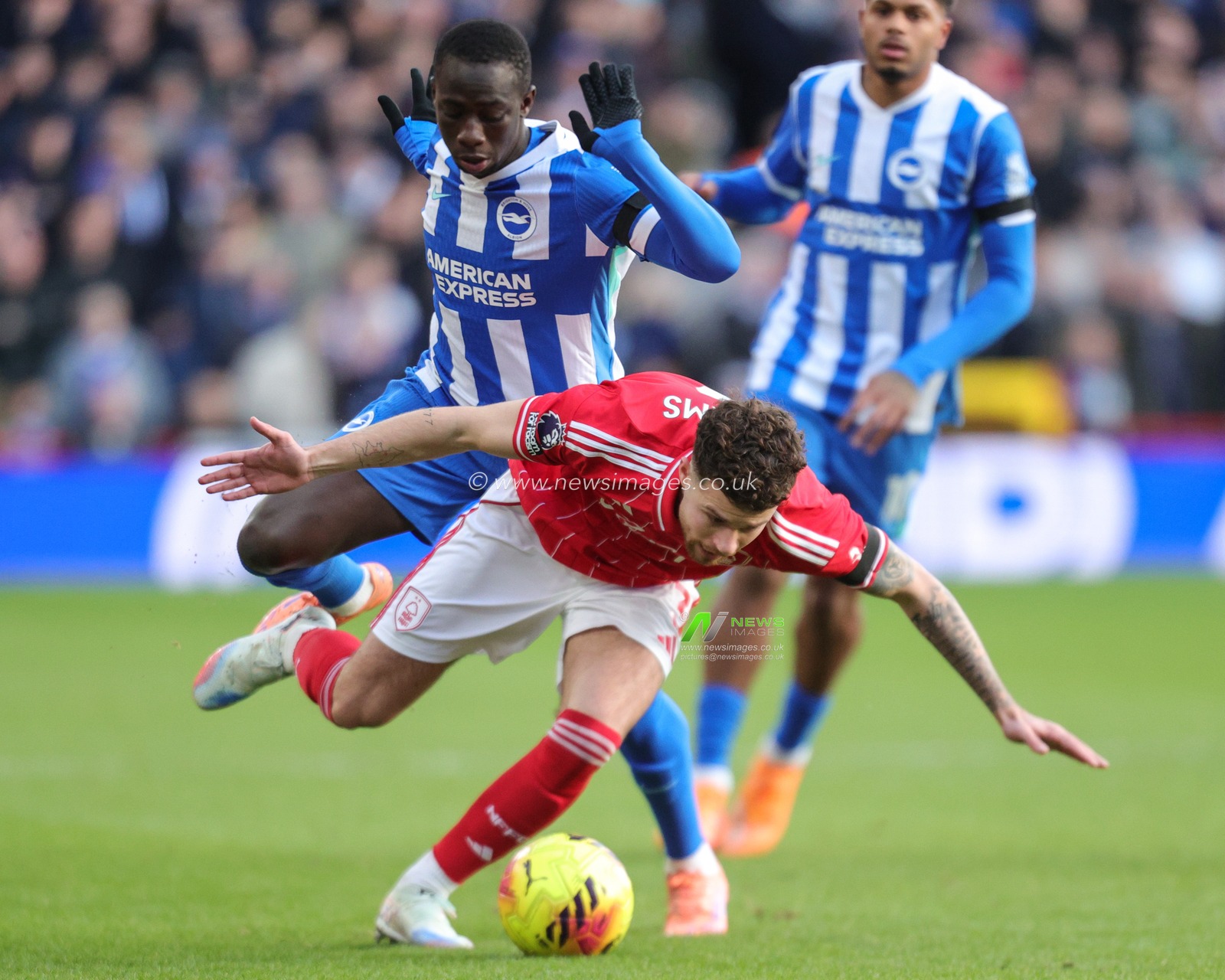 Neco Williams of Nottingham Forest is fouled by  Yankuba Minteh of Brighton & Hove Albion during the Premier League match Nottingham Forest vs Brighton and Hove Albion at City Ground, Nottingham, United Kingdom, 30th November 2025

(Photo by Richard Bierton/News Images)

*** GER AUT SUI OUT ***