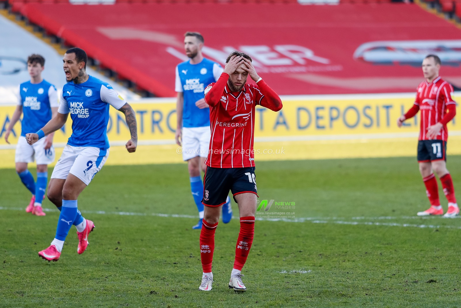 Jorge Grant #10 of Lincoln City holds his hands over his head after missing a penalty