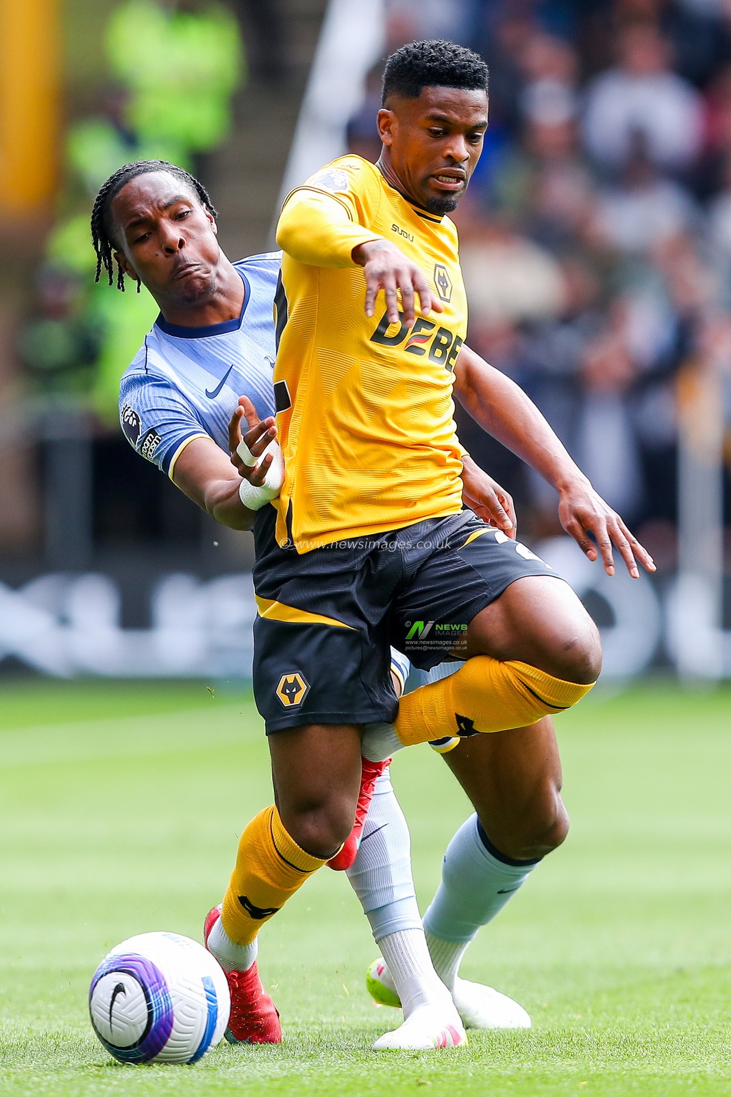 Nelson Semedo of Wolverhampton Wanderers is put under pressure by Mathys Tel of Tottenham Hotspur during the Premier League match Wolverhampton Wanderers vs Tottenham Hotspur at Molineux, Wolverhampton, United Kingdom, 13th April 2025

(Photo by Gareth Evans/News Images)