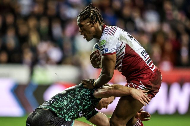 Junior Nsemba of Wigan Warriors is tackled by Jack Hughes of Leigh Leopards during the Betfred Super League match Wigan Warriors vs Leigh Leopards at The Brick Community Stadium, Wigan, United Kingdom on 26 February 2026

(Photo by Alfie Cosgrove/News Images)