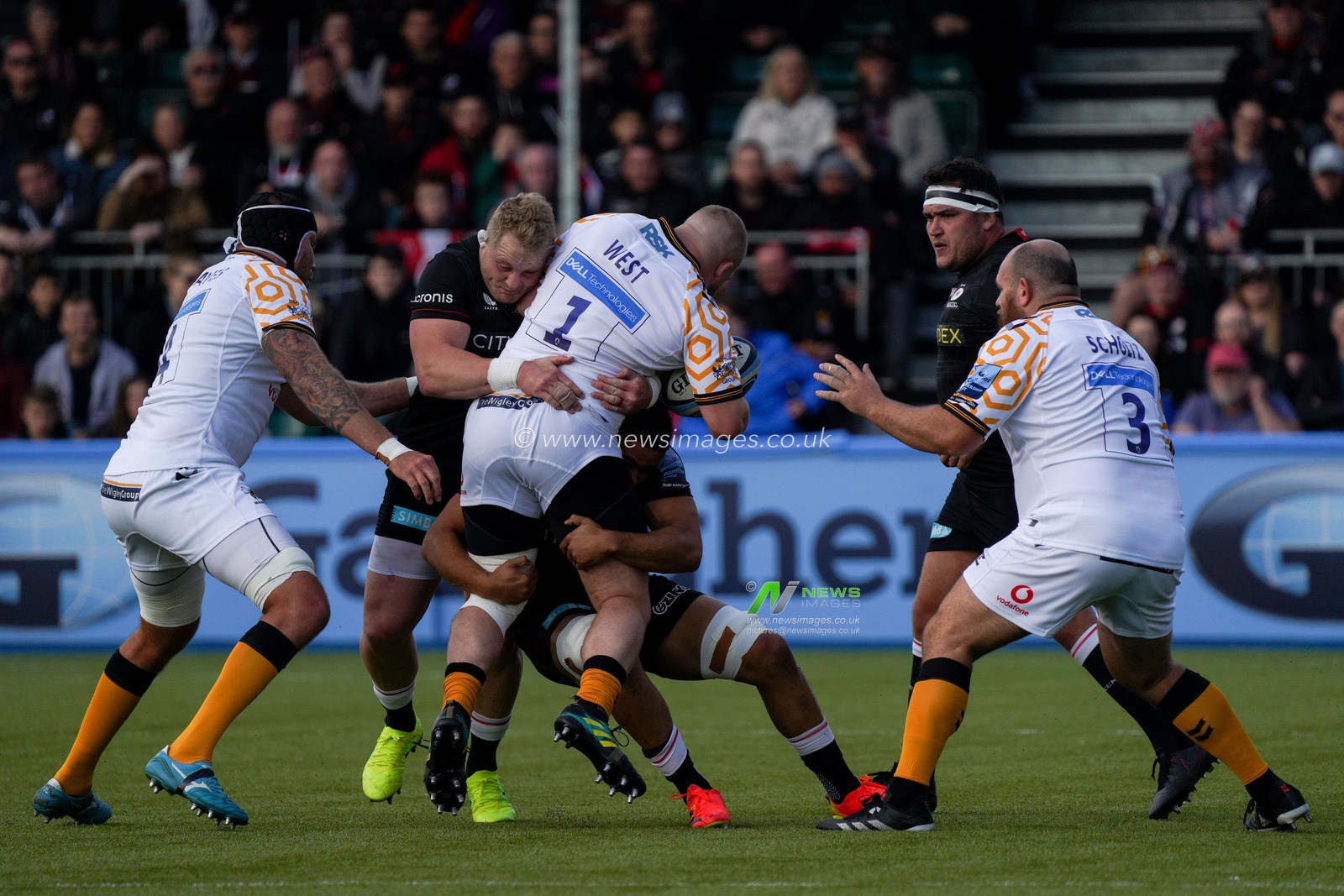 Tom West #1 of Wasps looks for a way through the Saracens defence