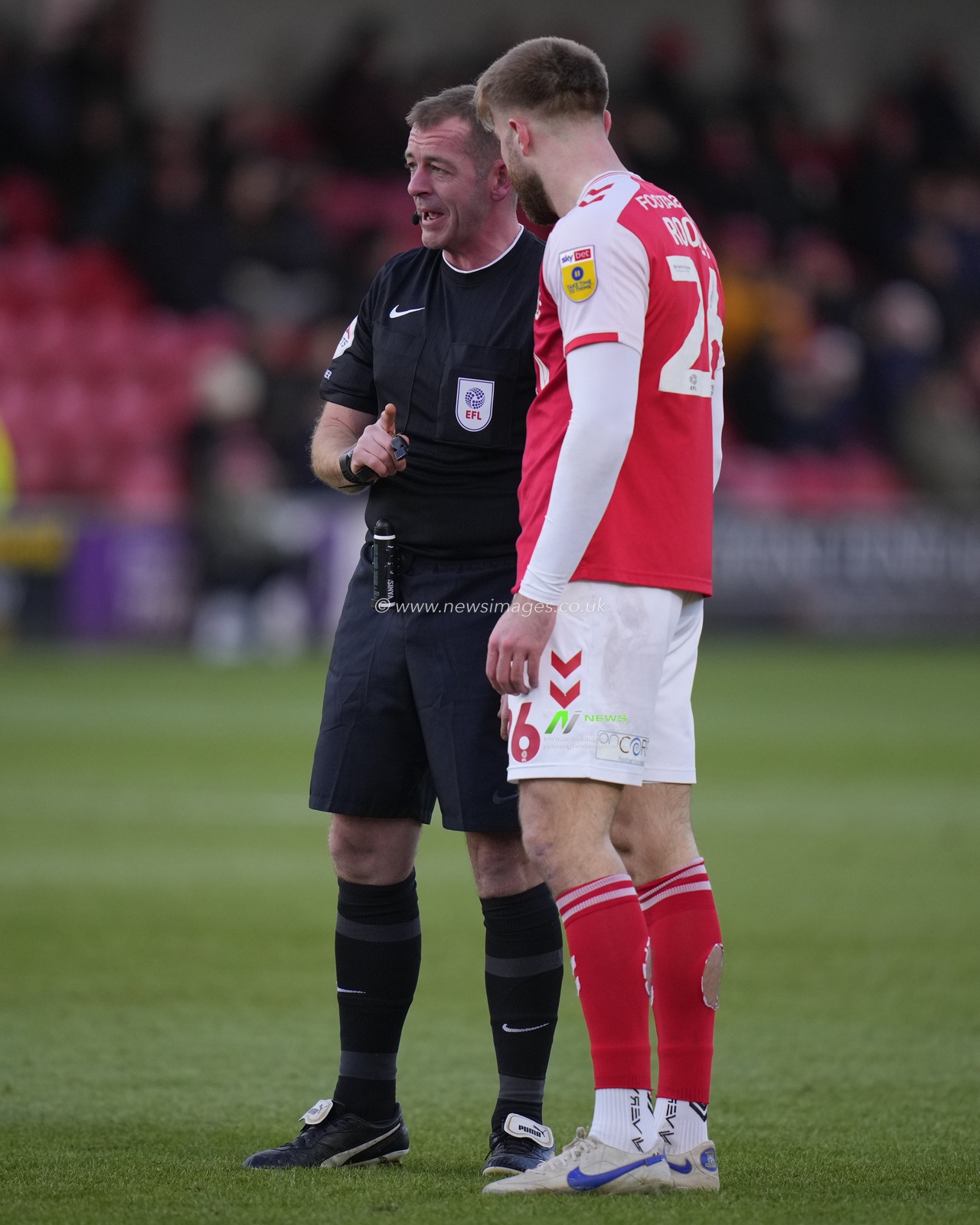 Referee Darren Handley speaks to Shaun Rooney #25 of Fleetwood Town early in the game during the Sky Bet League 1 match Fleetwood Town vs Sheffield Wednesday at Highbury Stadium, Fleetwood, United Kingdom, 26th December 2022

(Photo by Steve Flynn/News Images)