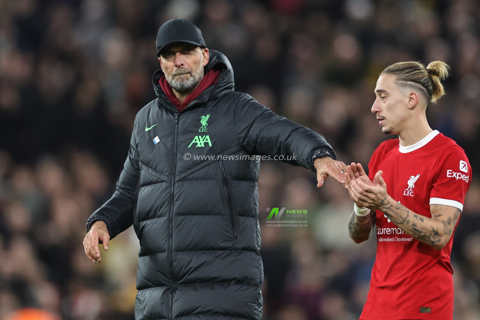 JÃ¼rgen Klopp manager of Liverpool high fives Kostas Tsimikas of Liverpool during the Premier League match Liverpool vs Manchester United at Anfield, Liverpool, United Kingdom, 17th December 2023

(Photo by Mark Cosgrove/News Images)