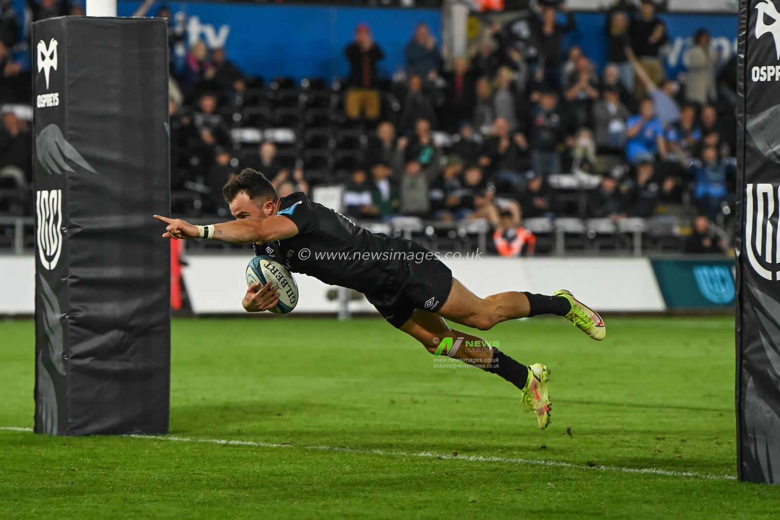 Luke Morgan of Ospreys goes over for a try