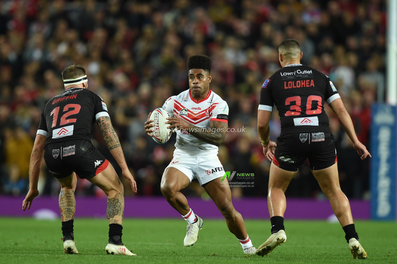 12th October 2019, Old Trafford, Manchester, England; The Grand Final 2019, Saint Helens v Salford Red Devils : Kevin Naiqama (3) of Saint Helens in action during the game ahead of George Griffin (12) of Salford Red Devils and Tuimoala Lolohea (30) of Salford Red Devils 

Credit: Richard Long/News Images
