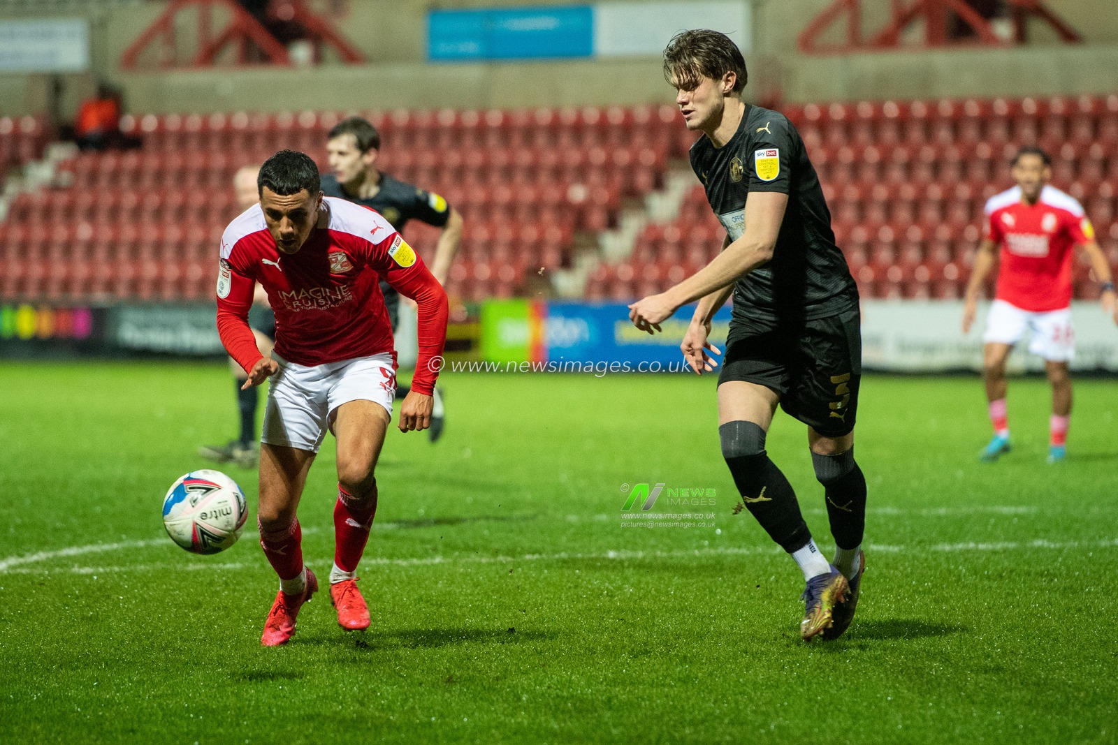 Tyler Smith #9 of Swindon Town looks to create some space to shoot at goal
