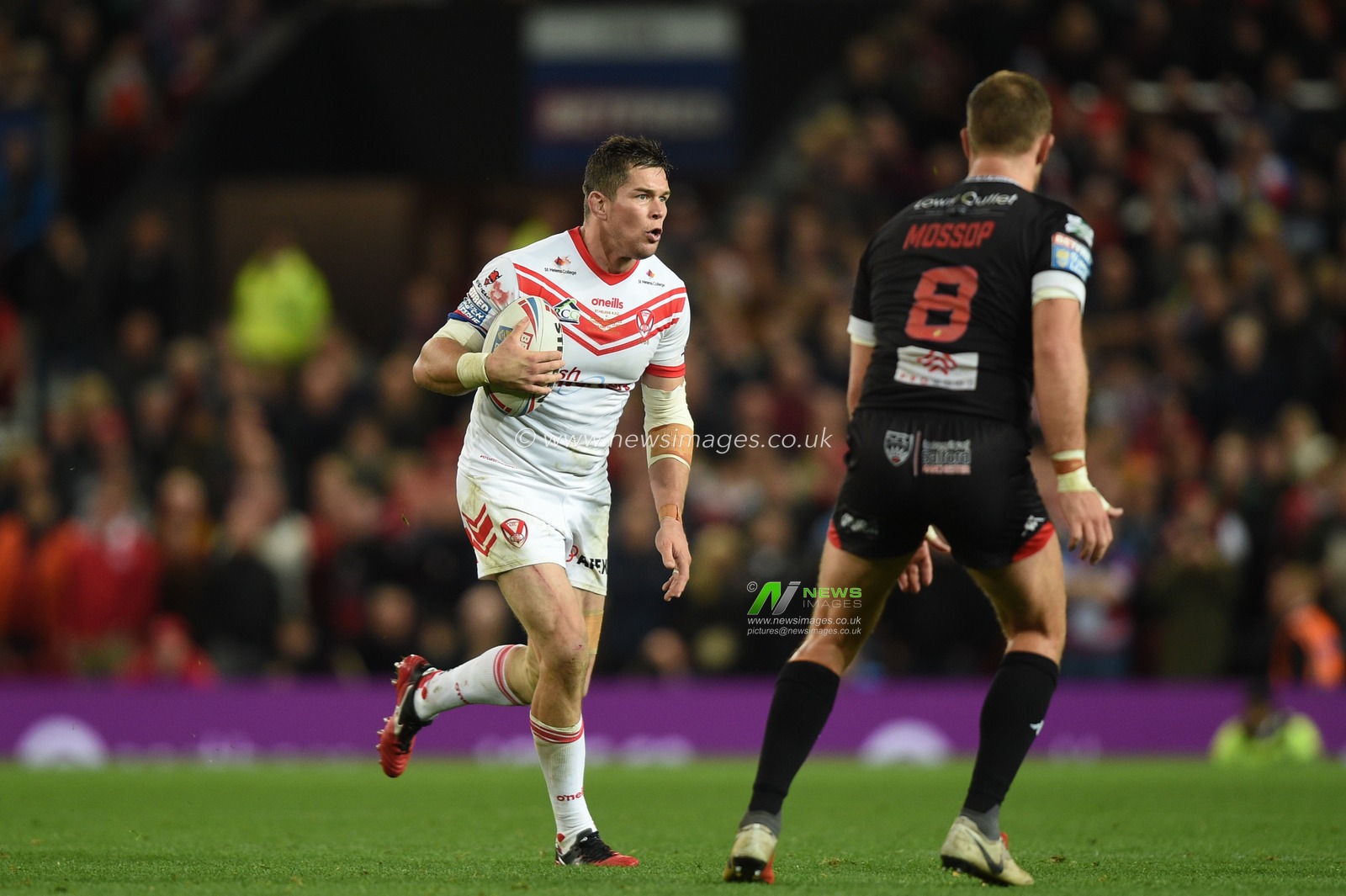 12th October 2019, Old Trafford, Manchester, England; The Grand Final 2019, Saint Helens v Salford Red Devils : Louie McCarthy-Scarsbrook (13) of Saint Helens in action during the game.ahead of Lee Mossop (8) of Salford Red Devils  

Credit: Richard Long/News Images