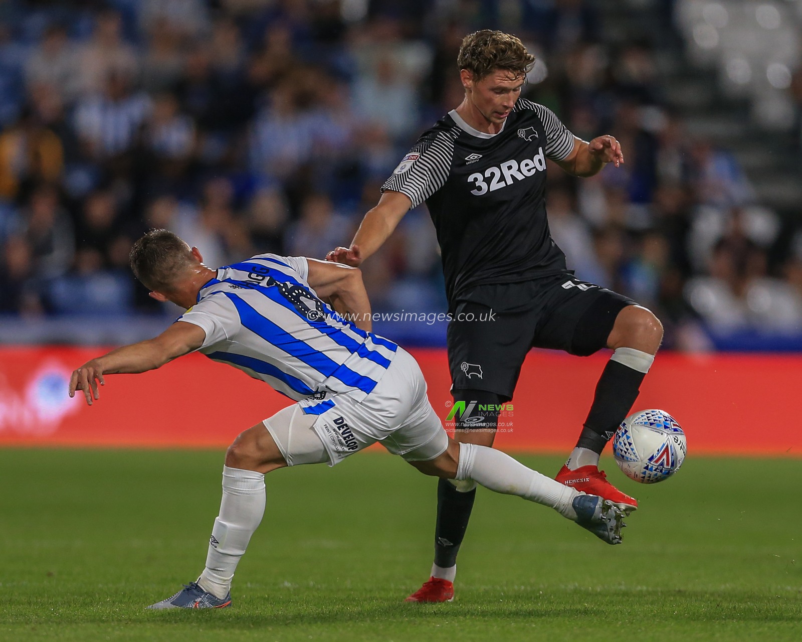 5th August 2019, John Smiths Stadium, Huddersfield England; Sky Bet Championship, Huddersfield Town vs Derby County ; Jonathan Hogg (6) of Huddersfield Town fouls George Evans (17) of Derby County 


Credit: Mark Cosgrove/News Images

English Football League images are subject to DataCo Licence