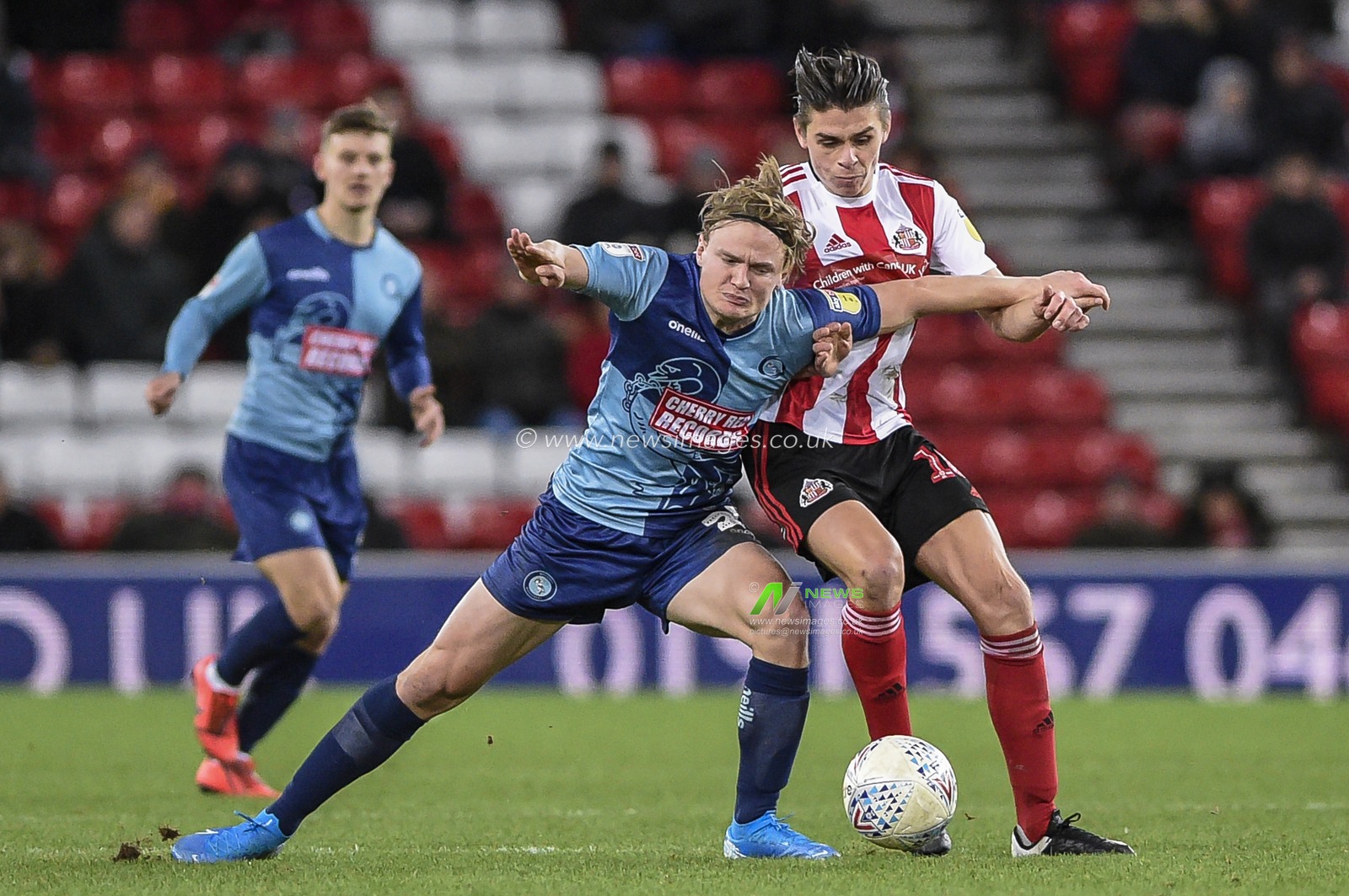 11th January 2020, Stadium Of Light, Sunderland, England; Sky Bet League 1, Sunderland v Wycombe Wanderers : Alex Samuel (25) of Wycombe Wanderers battles for possession with George Dobson (18) of Sunderland

Credit: Iam Burn/News Images