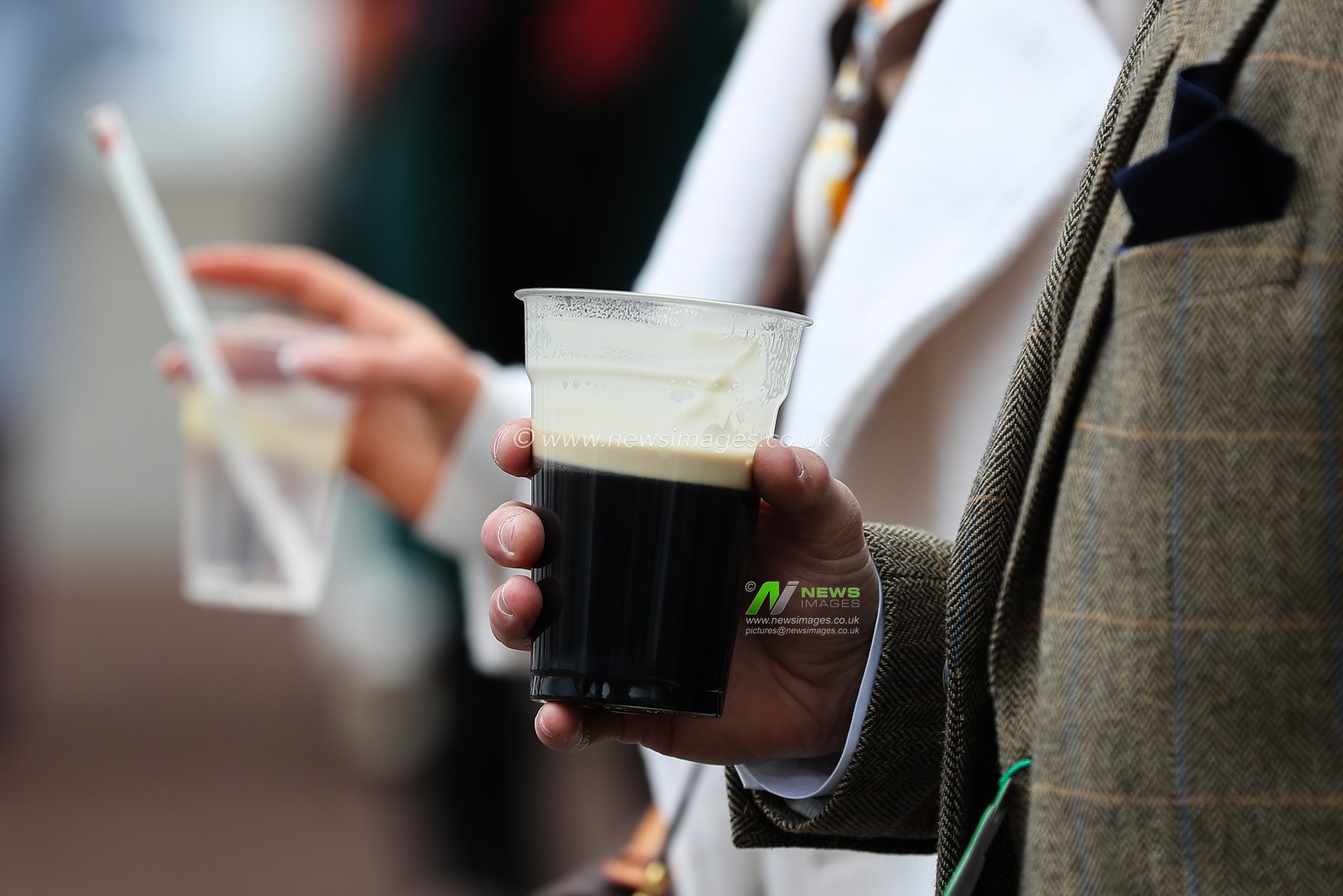 Racegoers with a pint of Guinness ahead of the Cheltenham Festival 2025 St Patrickâ€™s Thursday at Cheltenham Racecourse, Cheltenham, United Kingdom, 13th March 2025

(Photo by Gareth Evans/News Images)