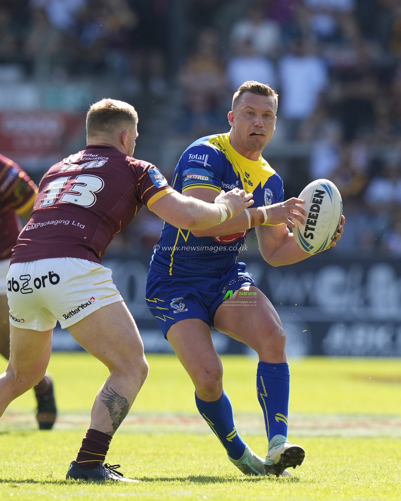 Josh Drinkwater of Warrington Wolves sets to pass during the Betfred Challenge Cup Semi-Final match Huddersfield Giants vs Warrington Wolves at Totally Wicked Stadium, St Helens, United Kingdom, 19th May 2024

(Photo by Steve Flynn/News Images)