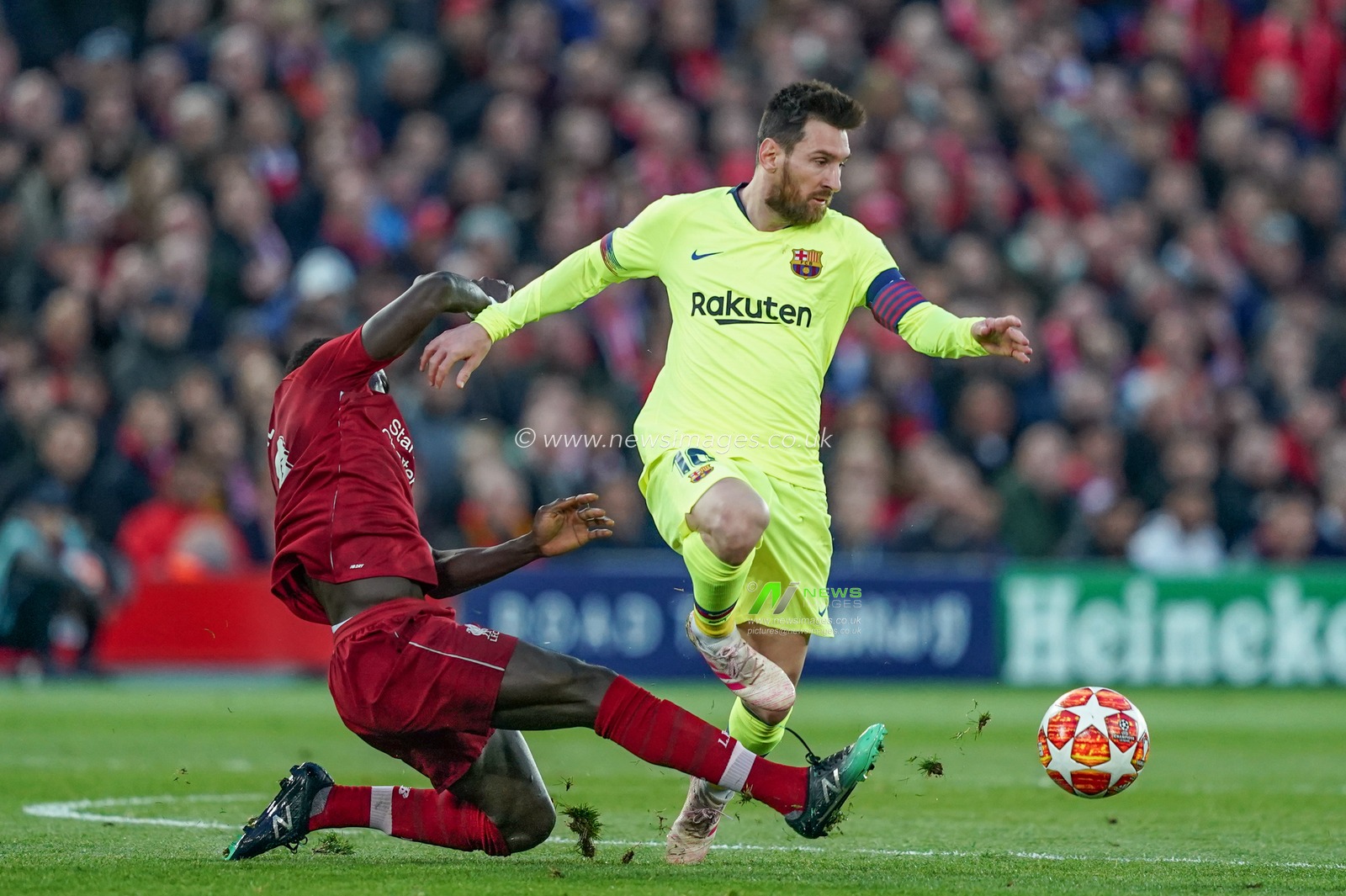 7th May 2019 , Anfield Stadium, Liverpool, England;  UEFA Champions League Semi Final, Second Leg, Liverpool FC vs FC Barcelona ; Sadio Mane (10) of Liverpool slides in to win the ball from Lionel Messi (10) of Barcelona 


Credit: Terry Donnelly/News Images